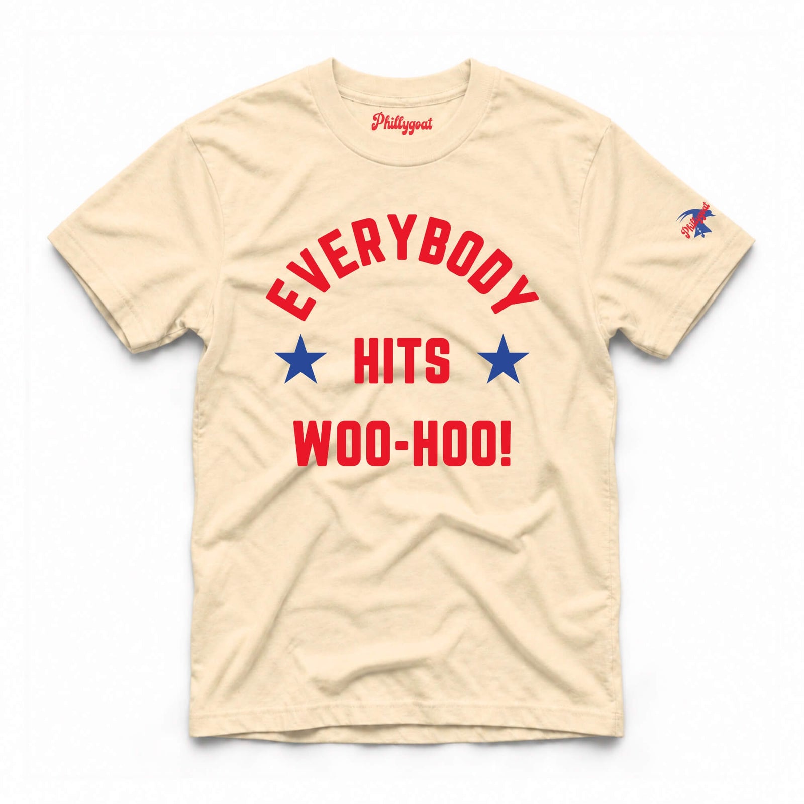 A beige short-sleeve t-shirt with a red and blue graphic on the front that reads 'EVERYBODY HITS WOO-HOO!' with two blue stars, and a small eagle logo on the left sleeve. The brand name 'Philadelphia' is printed inside the collar.