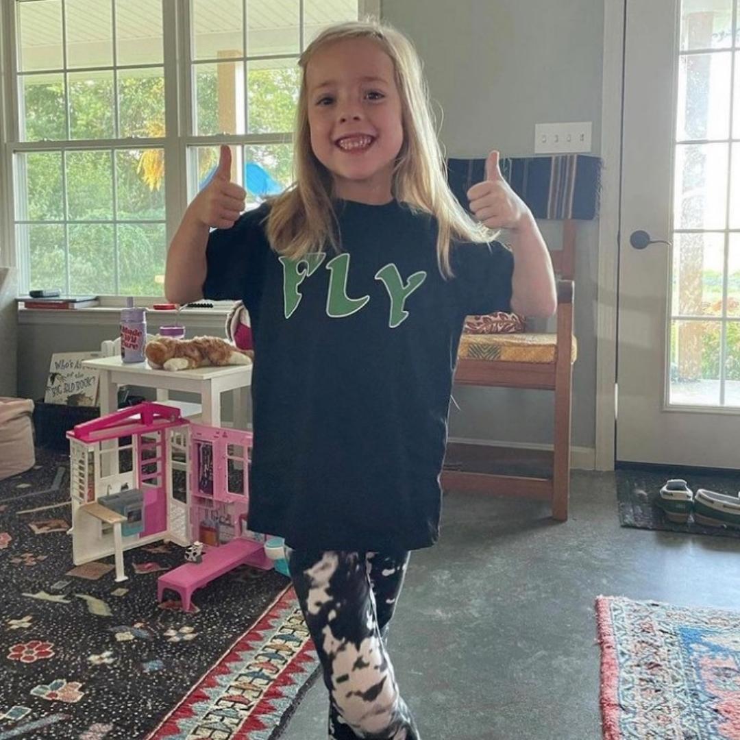 Girl wearing a Philadelphia Eagles FLY shirt from Phillygoat