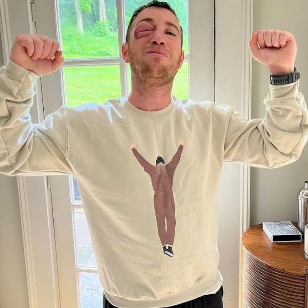 Guy wearing a Philadelphia Philly Rockey Balboa sweatshirt from Phillygoat