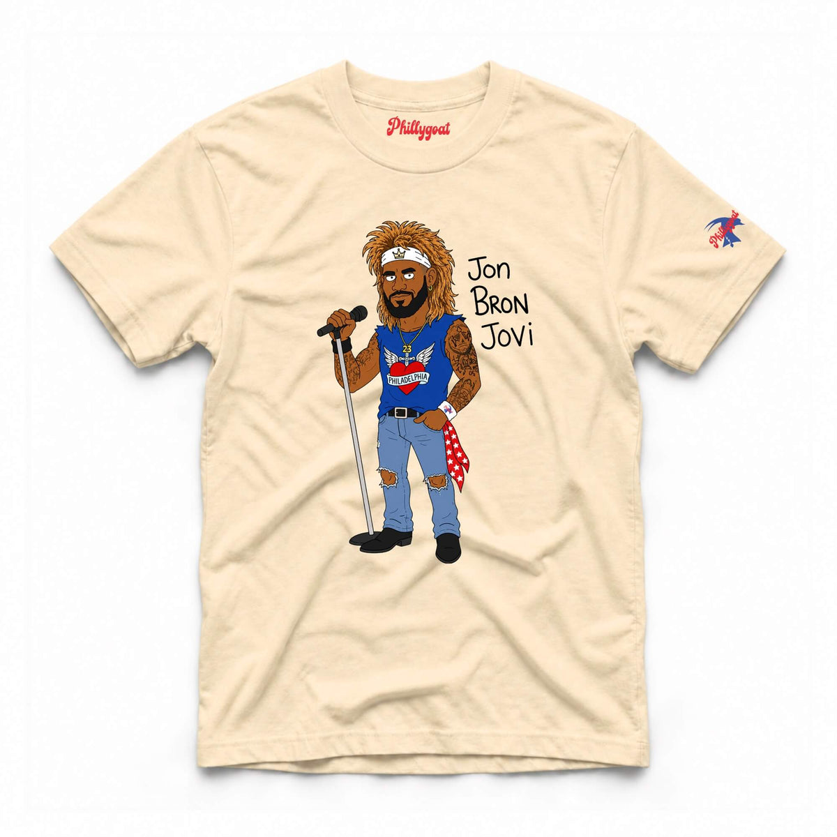 A beige short-sleeve t-shirt featuring a cartoon graphic of LeBron James as Jon Bon Jovi holding a microphone, with 'Jon Bron Jovi' printed next to him. The brand 'Phillygoat' is visible in red script inside the collar, and a small multicolor logo is printed on the left sleeve.