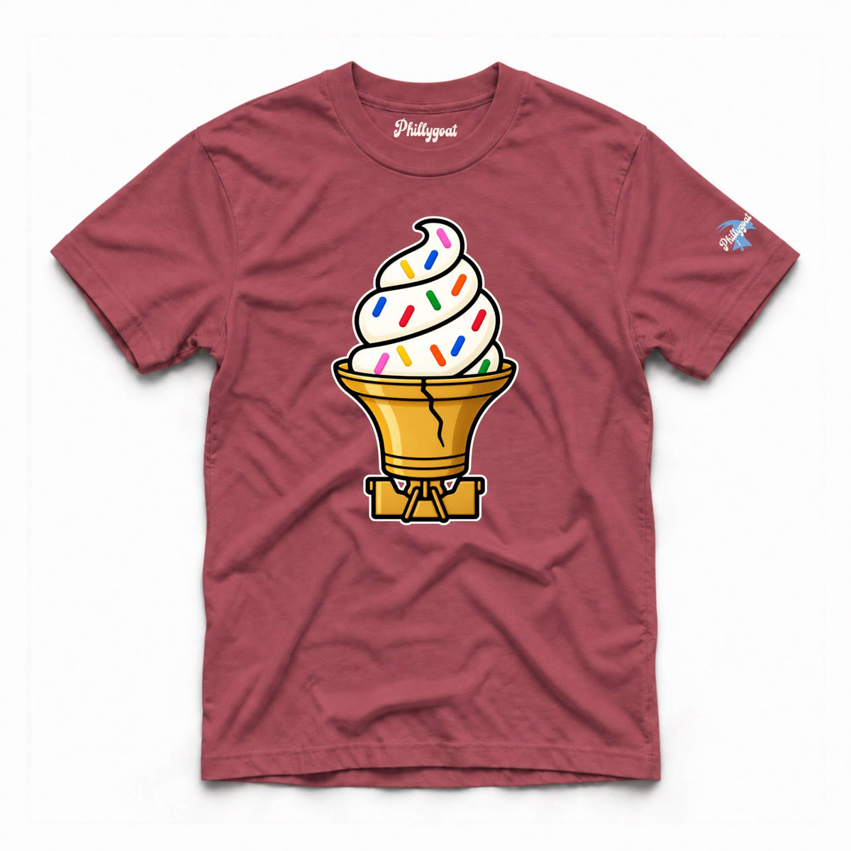 A maroon crewneck t-shirt featuring a graphic of a soft-serve ice cream cone with colorful sprinkles and a cracked cone, displayed flat against a white background.