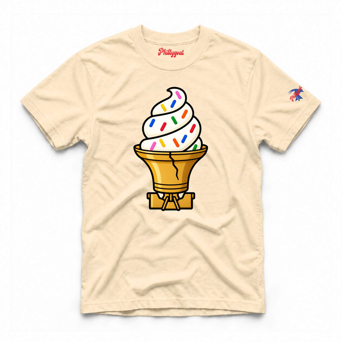 A light beige crewneck t-shirt featuring a graphic of a soft-serve ice cream cone with colorful sprinkles and a gold cone. The word 'Phillygun' is printed in red on the inside neck label, and a small multicolor bird logo is on the right sleeve.