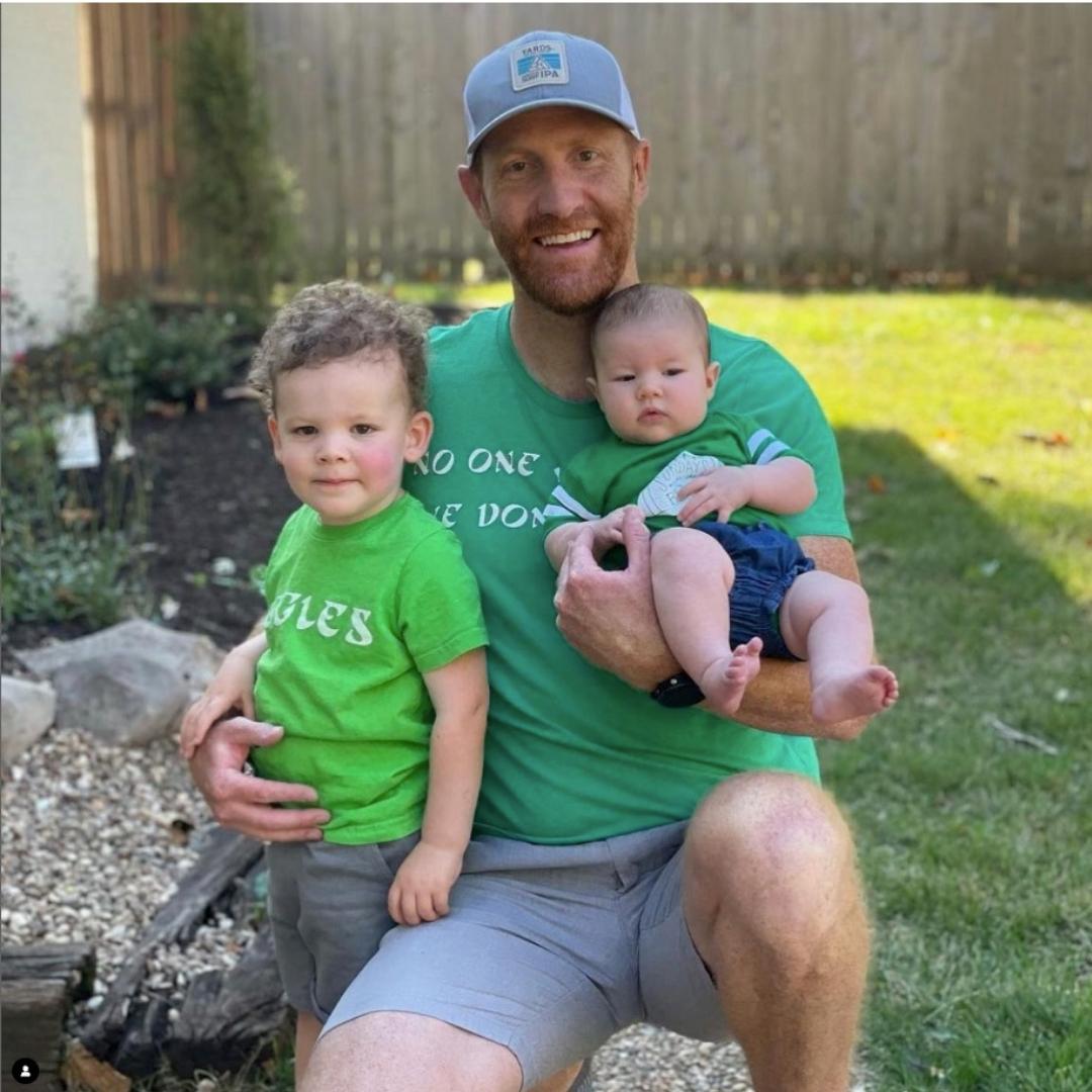 Family of Philadelphia Eagles fans wearing kelly green Iggles shirts from Phillygoat