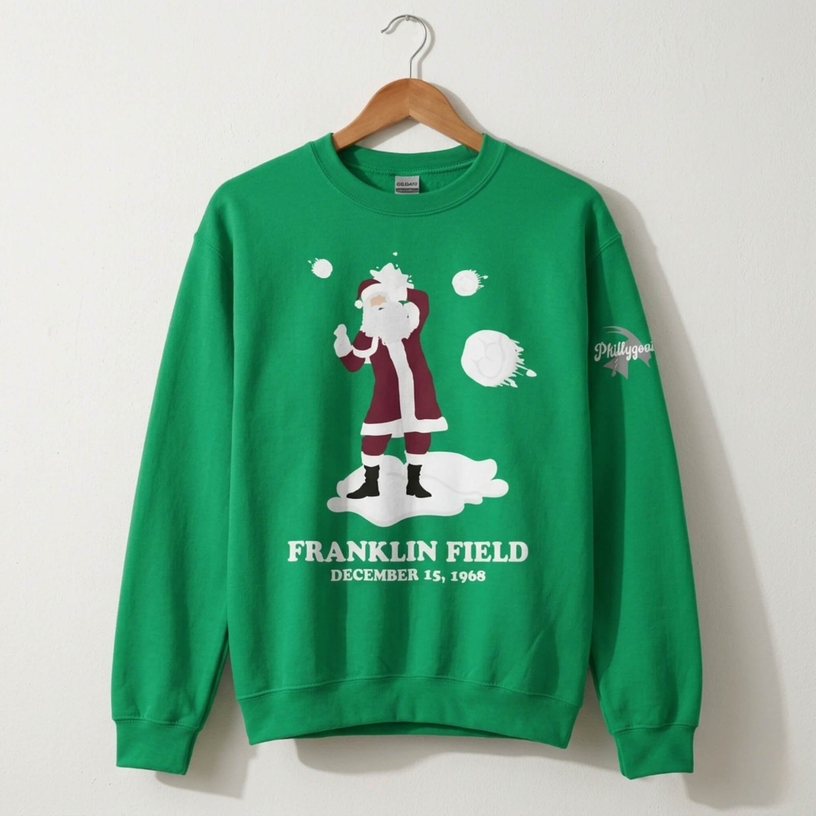 Philadelphia Eagles fans threw snowballs at Santa Clause kelly green sweatshirt by Phillygoat